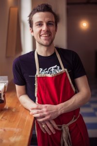 Man Wearing A Red Apron