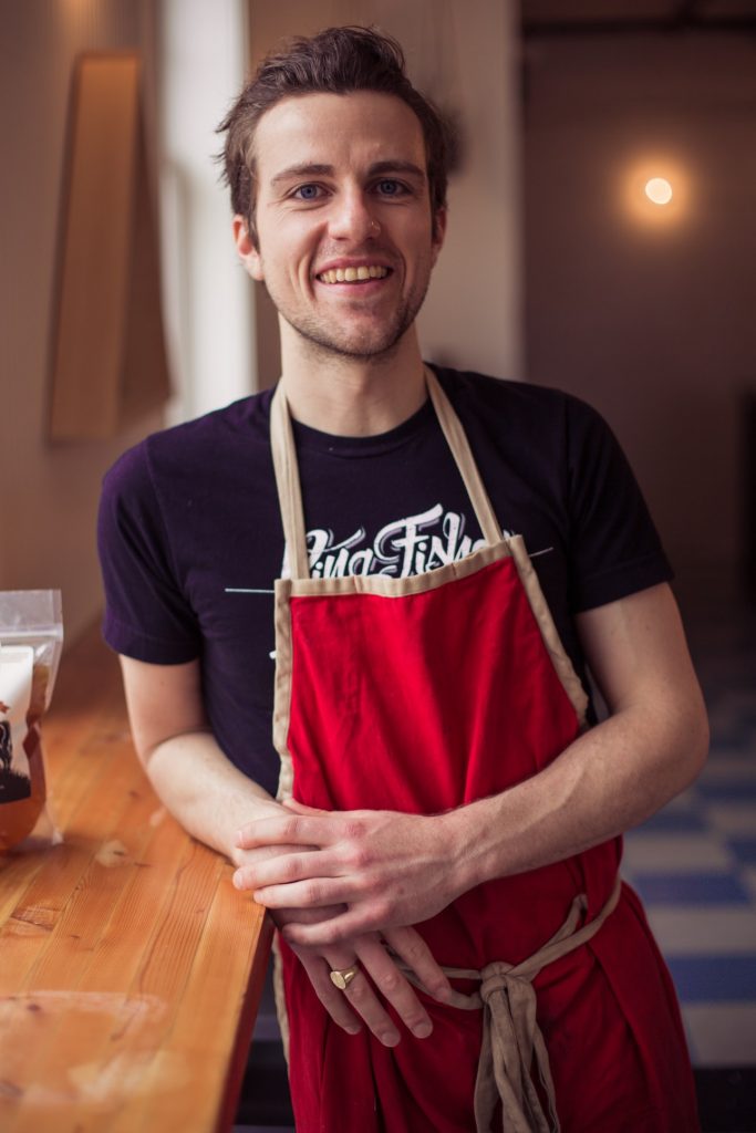 Man Wearing A Red Apron