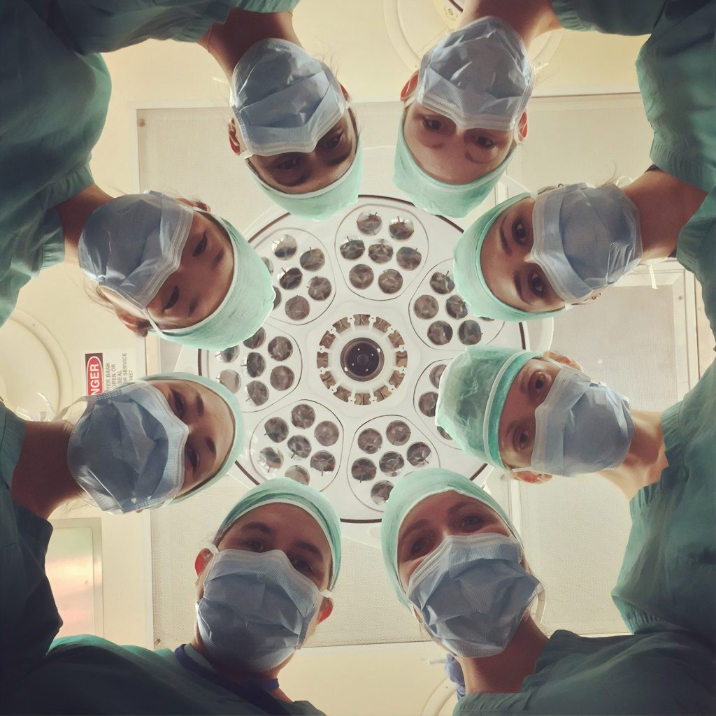 doctors in scrubs in an operating theatre